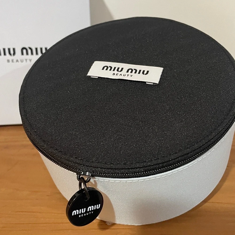 Miu Miu Two-Tone Round Cosmetic Case in Black & miu miu Sky Blue